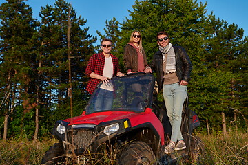 Image showing group young happy people enjoying beautiful sunny day while driving a off road buggy car