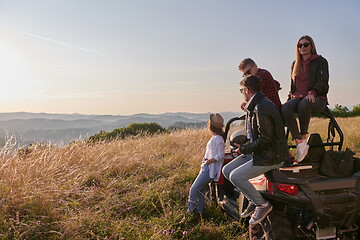 Image showing group young happy people enjoying beautiful sunny day while driving a off road buggy car