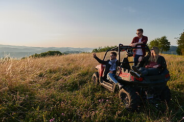 Image showing group young happy people enjoying beautiful sunny day while driving a off road buggy car