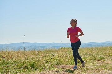 Image showing woman enjoying in a healthy lifestyle while jogging