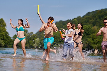 Image showing group of happy friends having fun on river