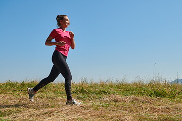 Image showing woman enjoying in a healthy lifestyle while jogging