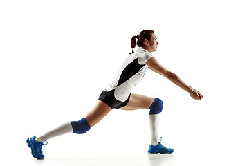 Image showing Young female volleyball player isolated on white studio background