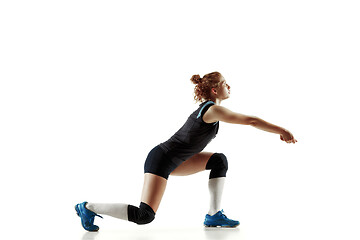 Image showing Young female volleyball player isolated on white studio background