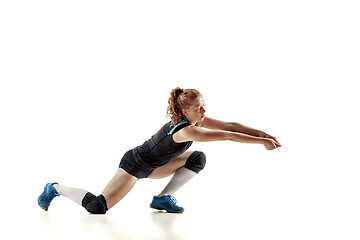 Image showing Young female volleyball player isolated on white studio background