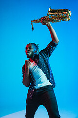 Image showing Young african-american jazz musician playing the saxophone