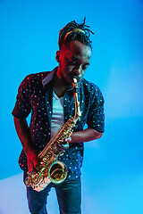 Image showing Young african-american jazz musician playing the saxophone