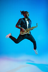 Image showing Young african-american jazz musician playing the saxophone