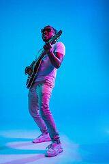 Image showing Young african-american jazz musician playing the guitar