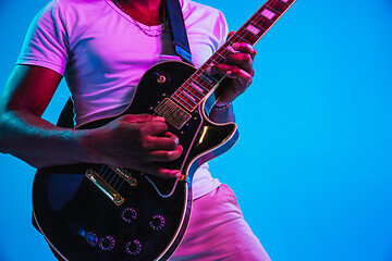 Image showing Young african-american jazz musician playing the guitar