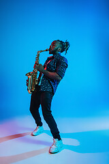 Image showing Young african-american jazz musician playing the saxophone