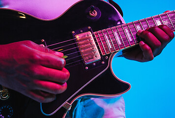 Image showing Young african-american jazz musician playing the guitar