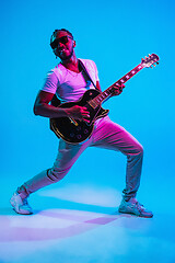 Image showing Young african-american jazz musician playing the guitar