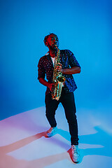Image showing Young african-american jazz musician playing the saxophone