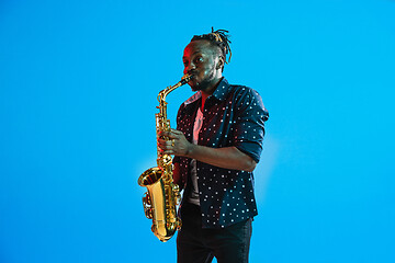 Image showing Young african-american jazz musician playing the saxophone