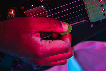 Image showing Young african-american jazz musician playing the guitar