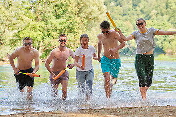 Image showing group of happy friends having fun on river