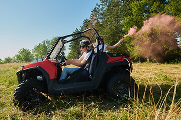 Image showing  colorful torches while driving a off road buggy car