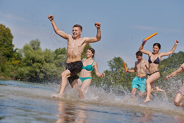 Image showing group of happy friends having fun on river