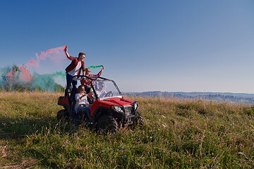 Image showing  colorful torches while driving a off road buggy car