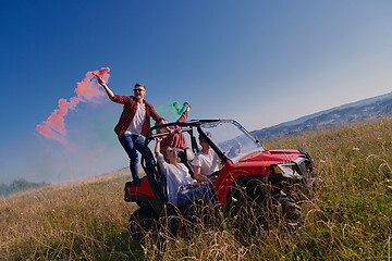 Image showing  colorful torches while driving a off road buggy car