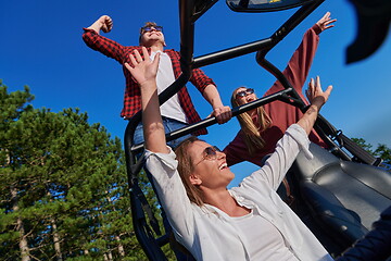 Image showing group young happy people enjoying beautiful sunny day while driving a off road buggy car