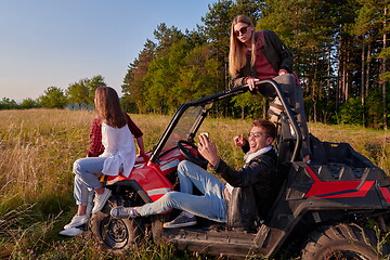 Image showing group young happy people enjoying beautiful sunny day while driving a off road buggy car