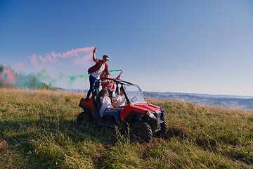 Image showing  colorful torches while driving a off road buggy car