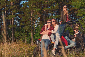 Image showing group young happy people enjoying beautiful sunny day while driving a off road buggy car