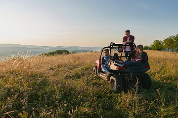 Image showing group young happy people enjoying beautiful sunny day while driving a off road buggy car