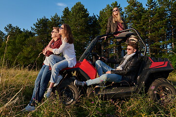 Image showing group young happy people enjoying beautiful sunny day while driving a off road buggy car