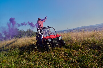 Image showing  colorful torches while driving a off road buggy car