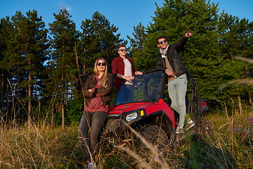 Image showing group young happy people enjoying beautiful sunny day while driving a off road buggy car