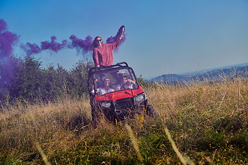 Image showing  colorful torches while driving a off road buggy car