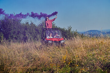 Image showing  colorful torches while driving a off road buggy car