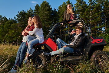 Image showing group young happy people enjoying beautiful sunny day while driving a off road buggy car