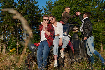 Image showing group young happy people enjoying beautiful sunny day while driving a off road buggy car