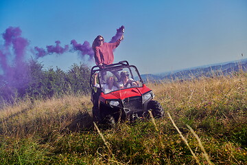 Image showing  colorful torches while driving a off road buggy car