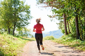 Image showing woman enjoying in a healthy lifestyle while jogging