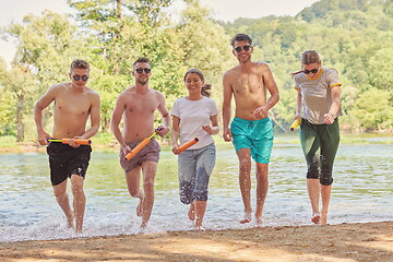 Image showing group of happy friends having fun on river