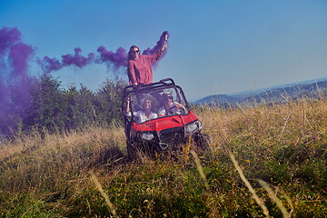 Image showing  colorful torches while driving a off road buggy car