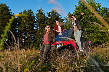 Image showing group young happy people enjoying beautiful sunny day while driving a off road buggy car