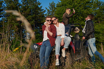 Image showing group young happy people enjoying beautiful sunny day while driving a off road buggy car