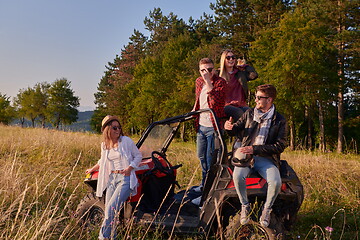 Image showing group young happy people enjoying beautiful sunny day while driving a off road buggy car