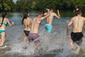 Image showing group of happy friends having fun on river