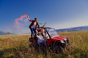 Image showing  colorful torches while driving a off road buggy car