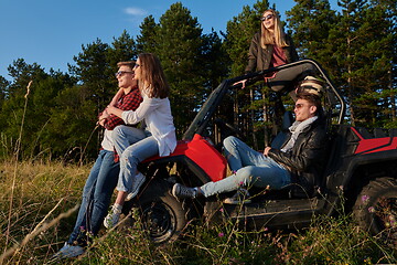 Image showing group young happy people enjoying beautiful sunny day while driving a off road buggy car