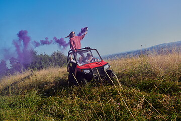 Image showing  colorful torches while driving a off road buggy car