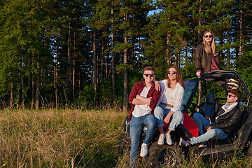 Image showing group young happy people enjoying beautiful sunny day while driving a off road buggy car
