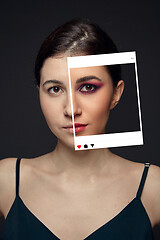 Image showing Lie and another life in social media. Girl with make up in photo frame and no make up in real life. Playing pretend.